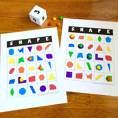 Photo of shape bingo with dice and board markers.