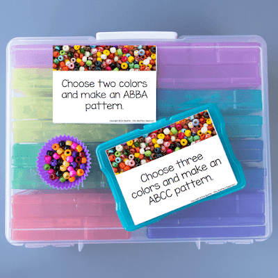Photo of beads and task cards on top of large container of task card holders.