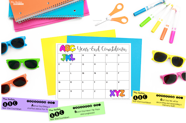 Photo of ABC Countdown calendar and event strips on white surface with school supplies and colorful sunglasses.