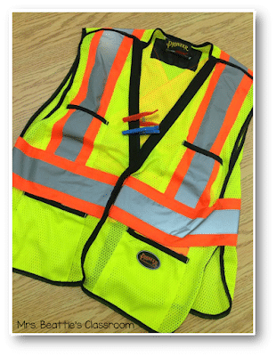 Photo of security vest with clothespin hall passes